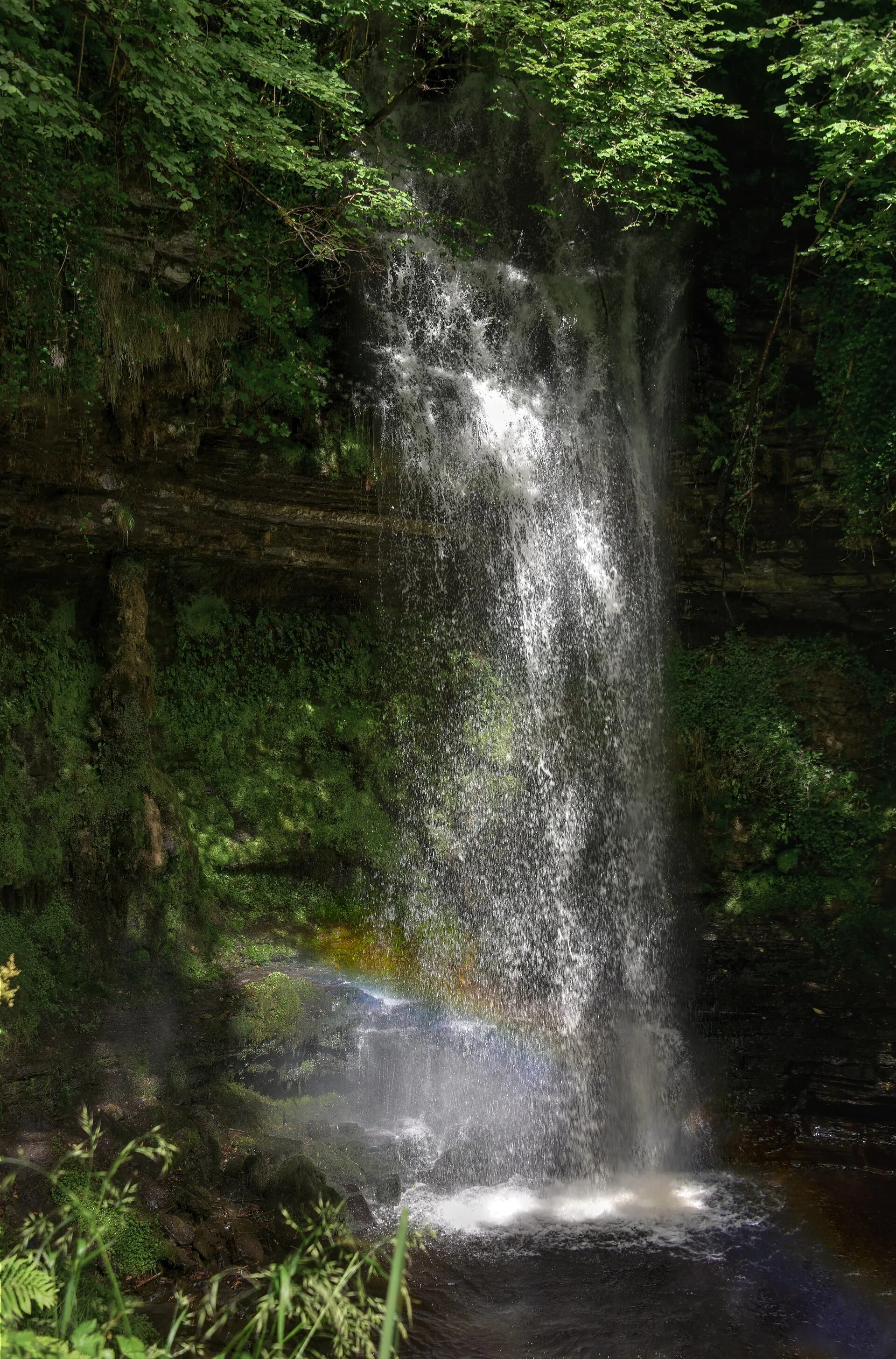 Glencar waterfall with rainbow