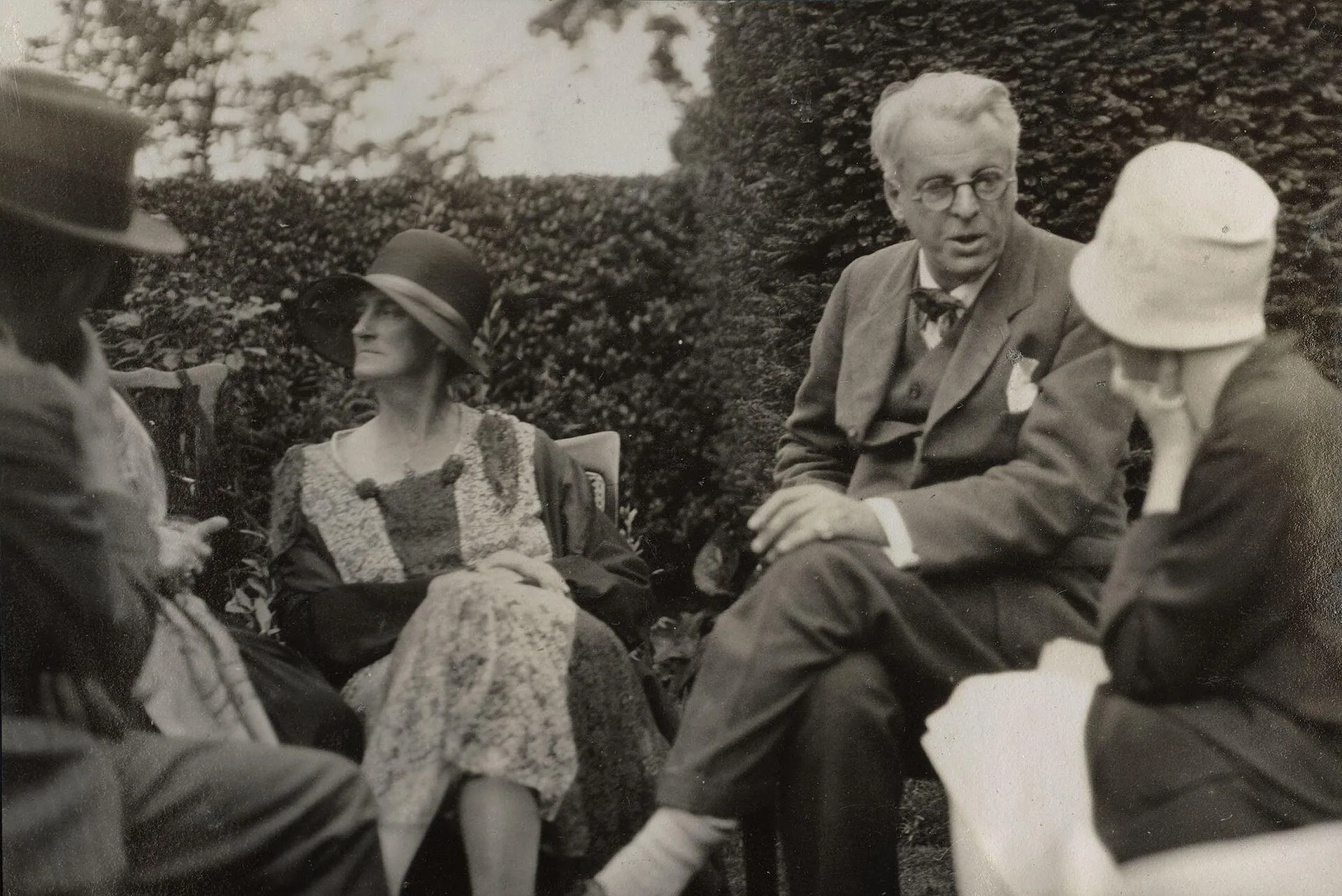 W. B. and George Yeats with Walter de la Mare, by Lady Ottoline Morrell